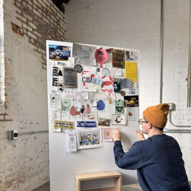 A simple to make stool that does double-duty as a pin-up board or sign holder.